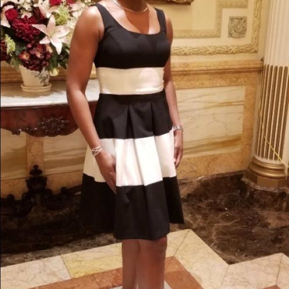 Fit and flare box pleat dress in black and white stripe.